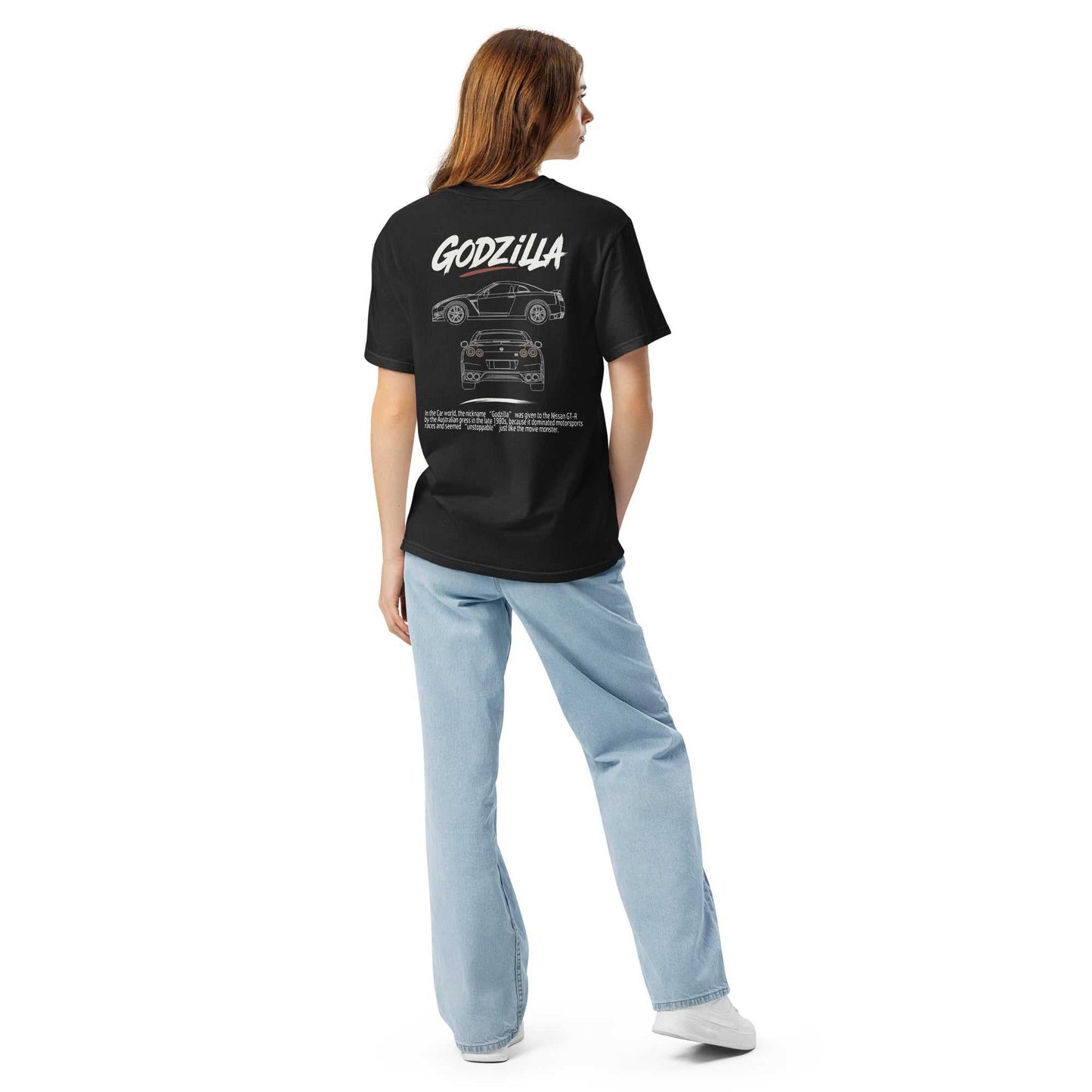 Woman wearing black Godzilla GT-R Blueprint tee with Nissan GT-R blueprint design and Godzilla lettering on the back