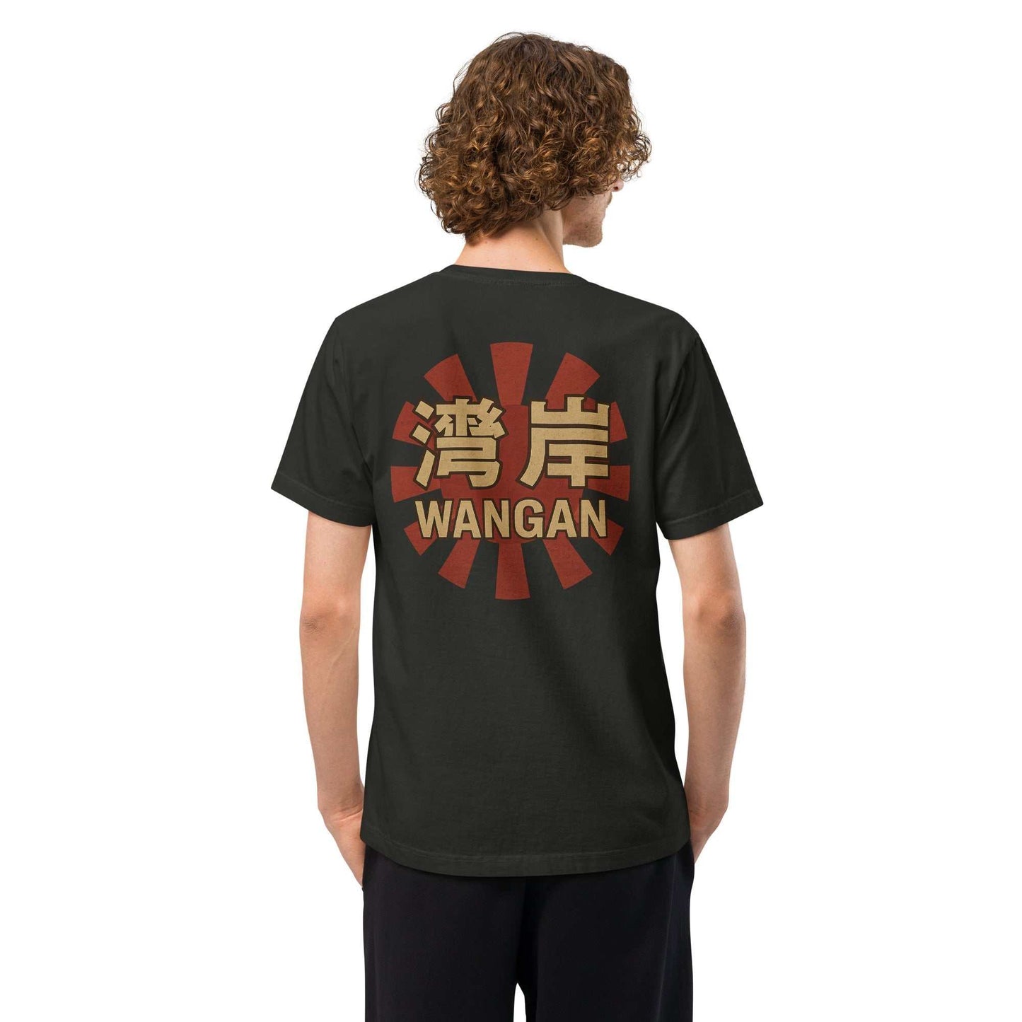 Back view of a person wearing a black oversized Wangan Rising Sun T-shirt from Downforce Apparel with a vintage red sunburst and gold Japanese characters design.