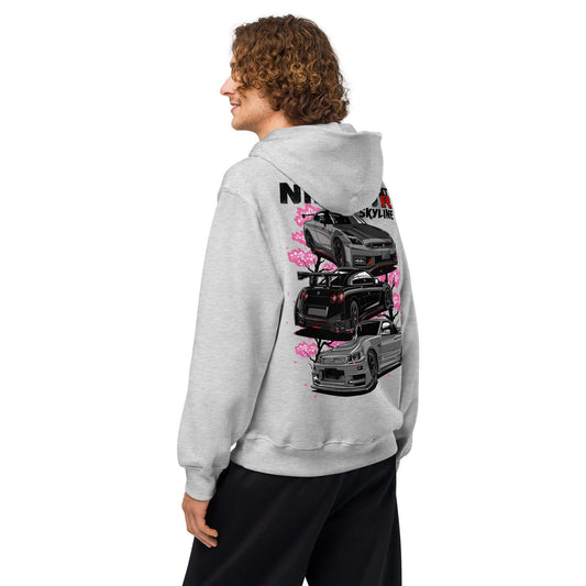 Man wearing gray Skyline Legends Sakura GT-R Hoodie with bold GT-R car and cherry blossom graphic on back