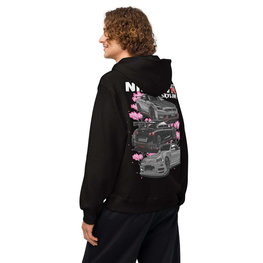 Man wearing black Skyline Legends Sakura GT-R Hoodie with GT-R car and cherry blossom graphic on back