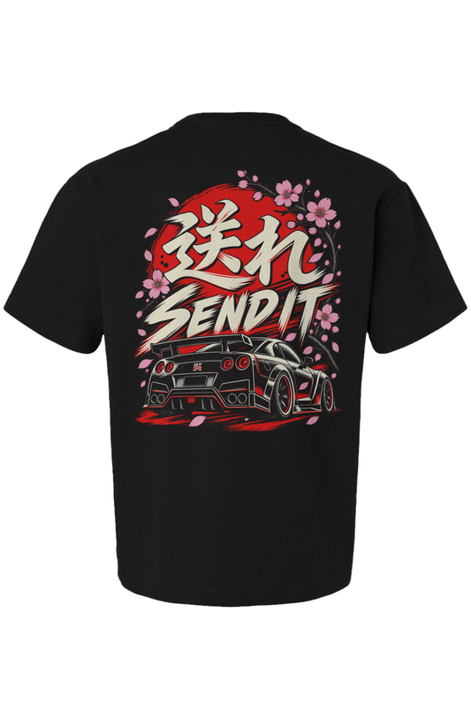 Black t-shirt back featuring GT-R illustration, "SEND IT" text, Japanese characters, and cherry blossoms against a red sun. JDM street racing culture design.
