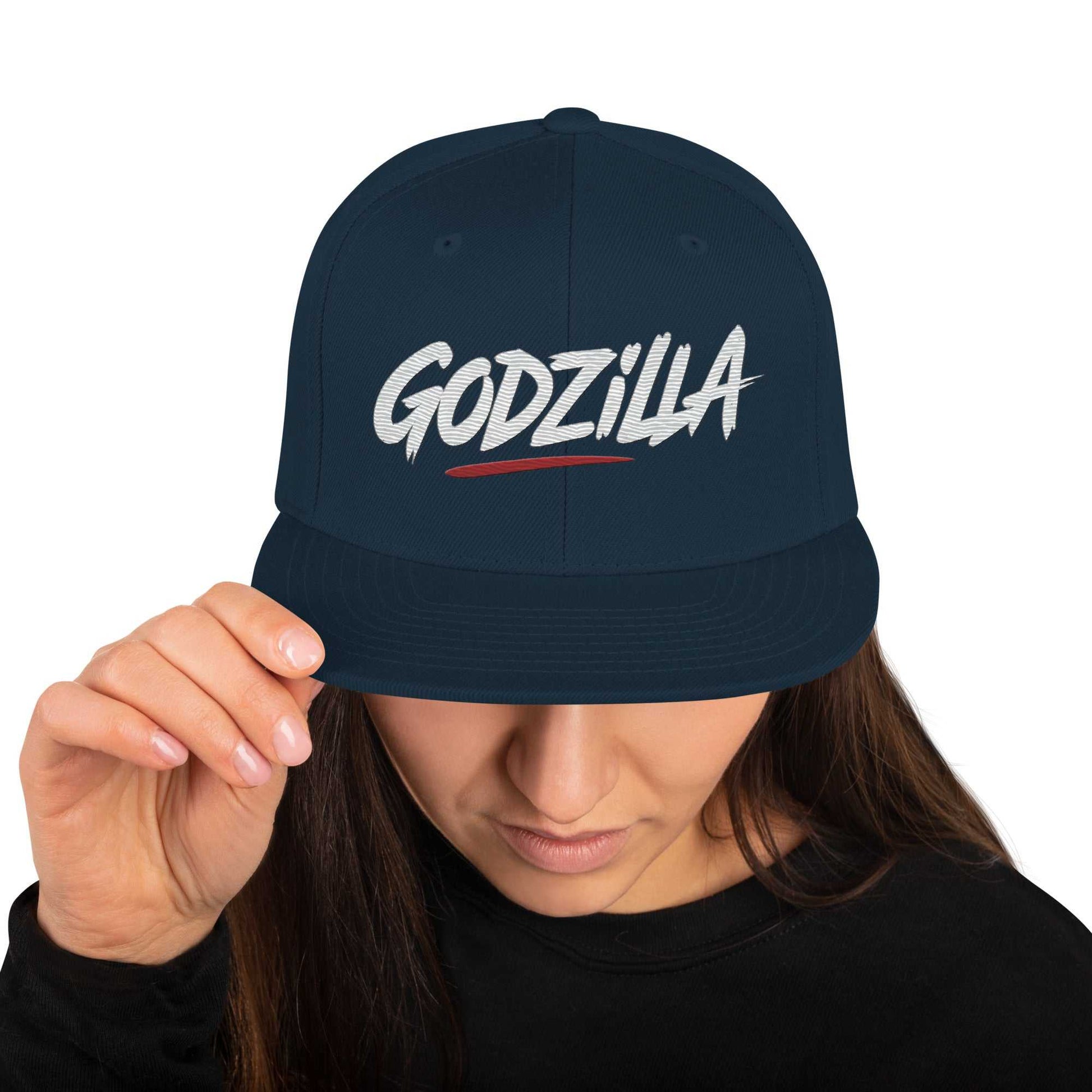 Black Godzilla Flat Brim Hat with embroidered logo worn by person