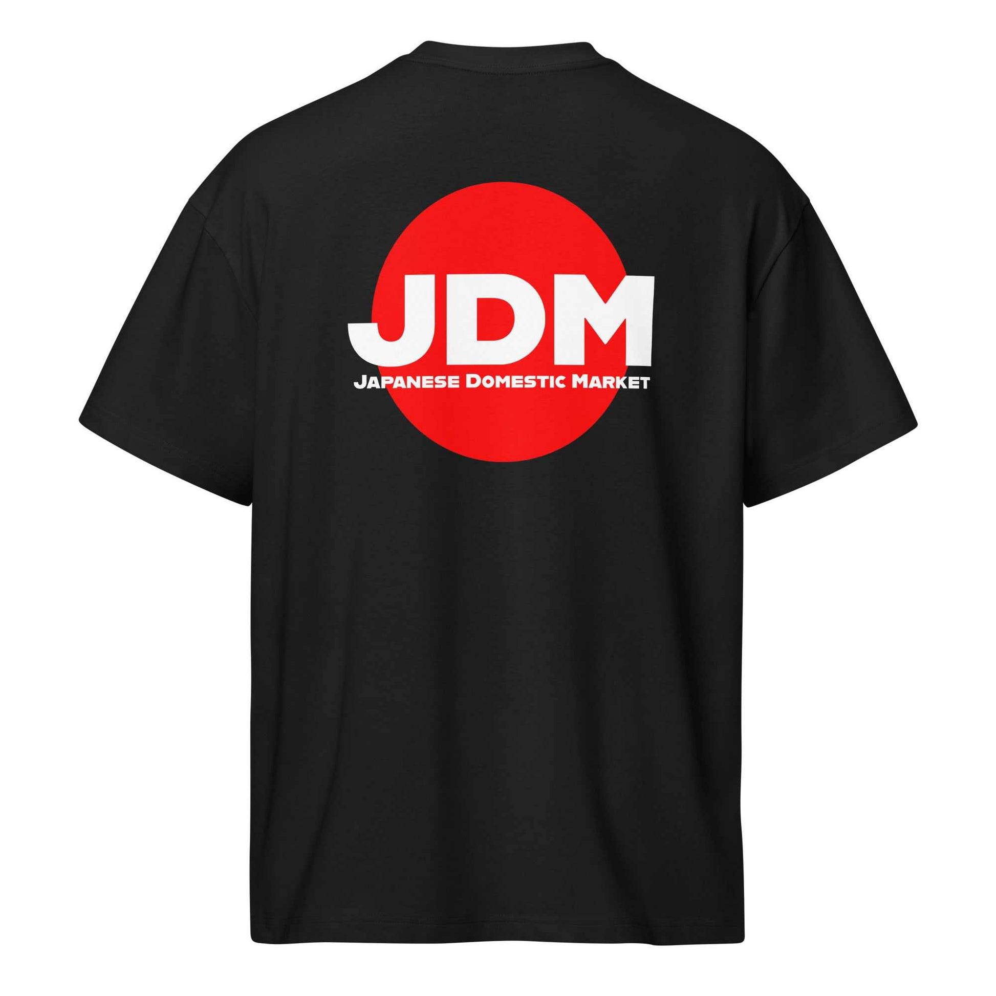Black JDM box tee with bold white "JDM" letters and red circle logo on the back, oversized fit with drop shoulder sleeves.