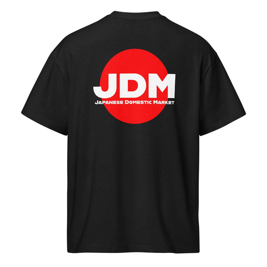 Black JDM box tee with bold white "JDM" letters and red circle logo on the back, oversized fit with drop shoulder sleeves.
