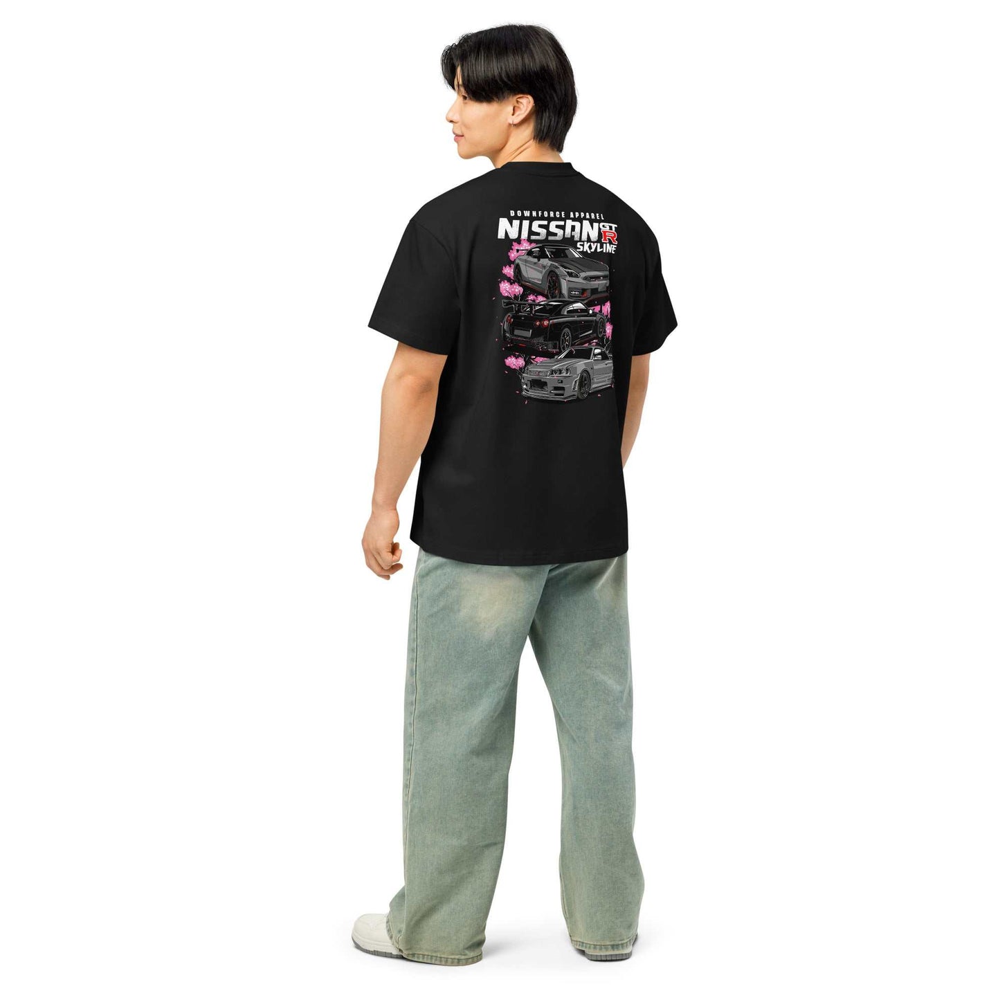 Man wearing Skyline Legends Sakura GT-R Tee featuring Nissan GT-R cars and cherry blossoms on black shirt back