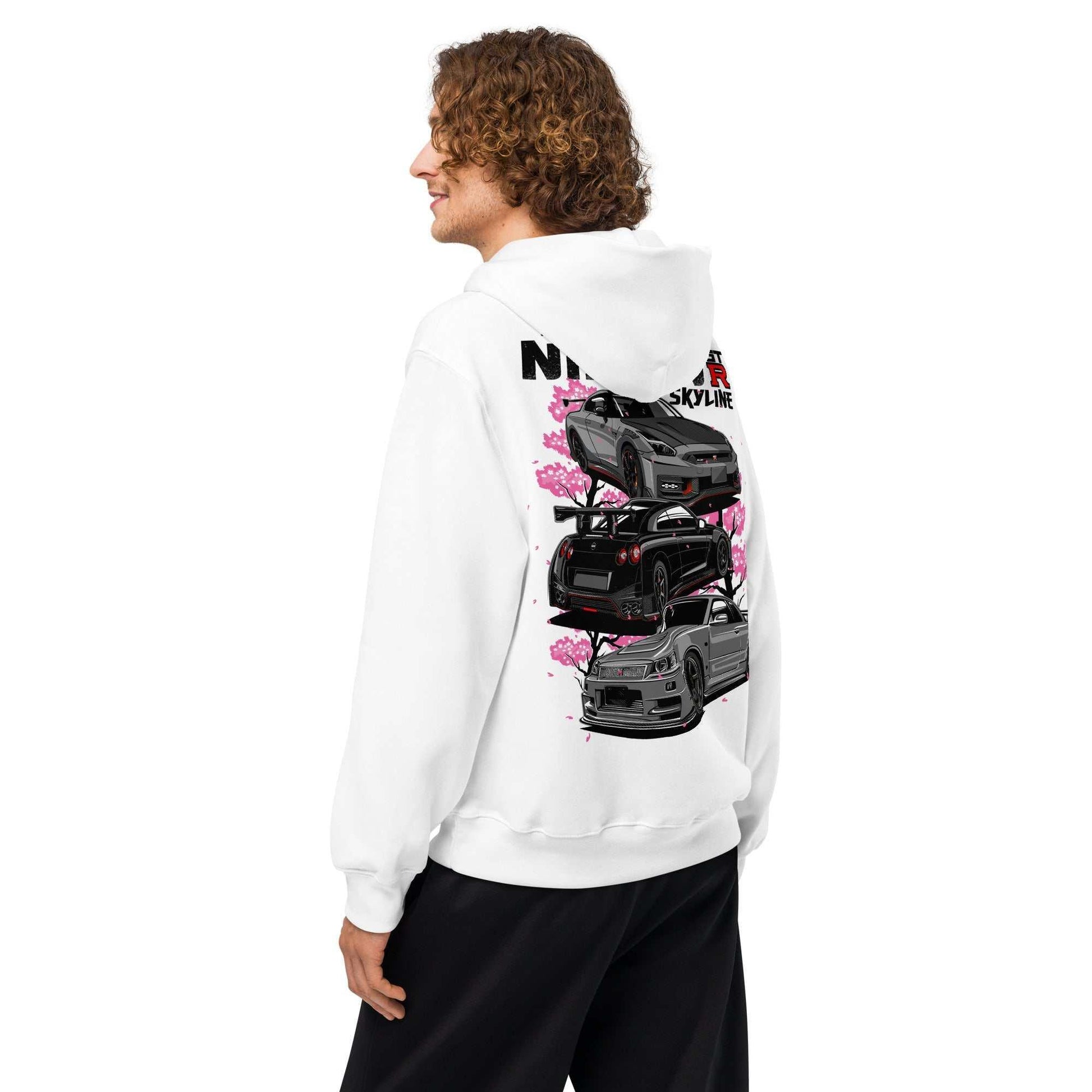 Man wearing white Skyline Legends Sakura GT-R Hoodie with detailed black GT-R cars and pink cherry blossoms design on the back