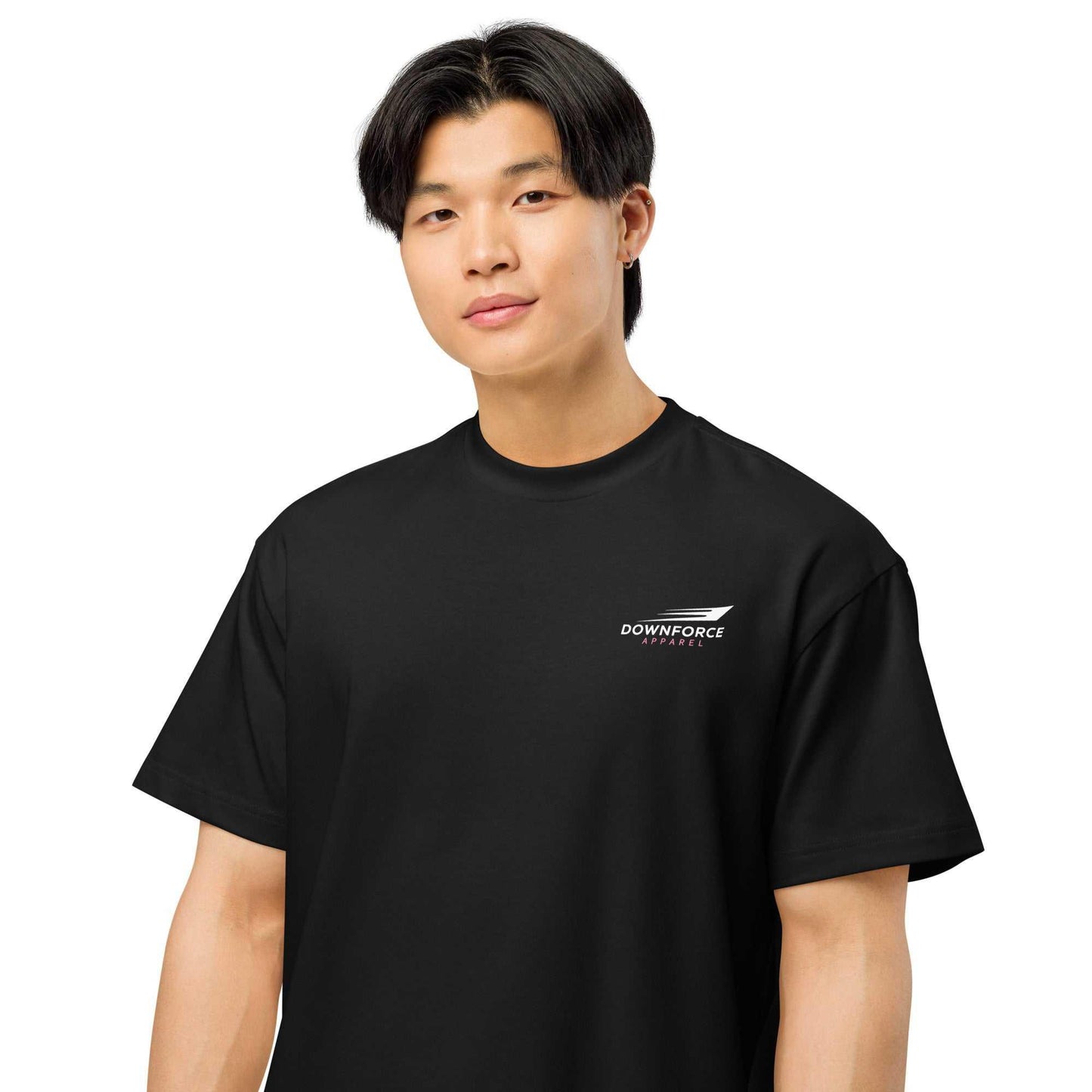 Man wearing black streetwear tee with Downforce Apparel logo, automotive fashion style
