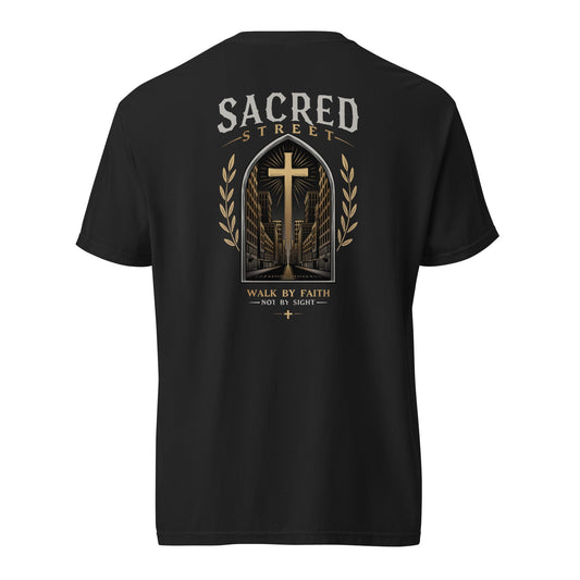 Black heavyweight unisex t-shirt with Sacred Street cross graphic and faith-inspired city design.