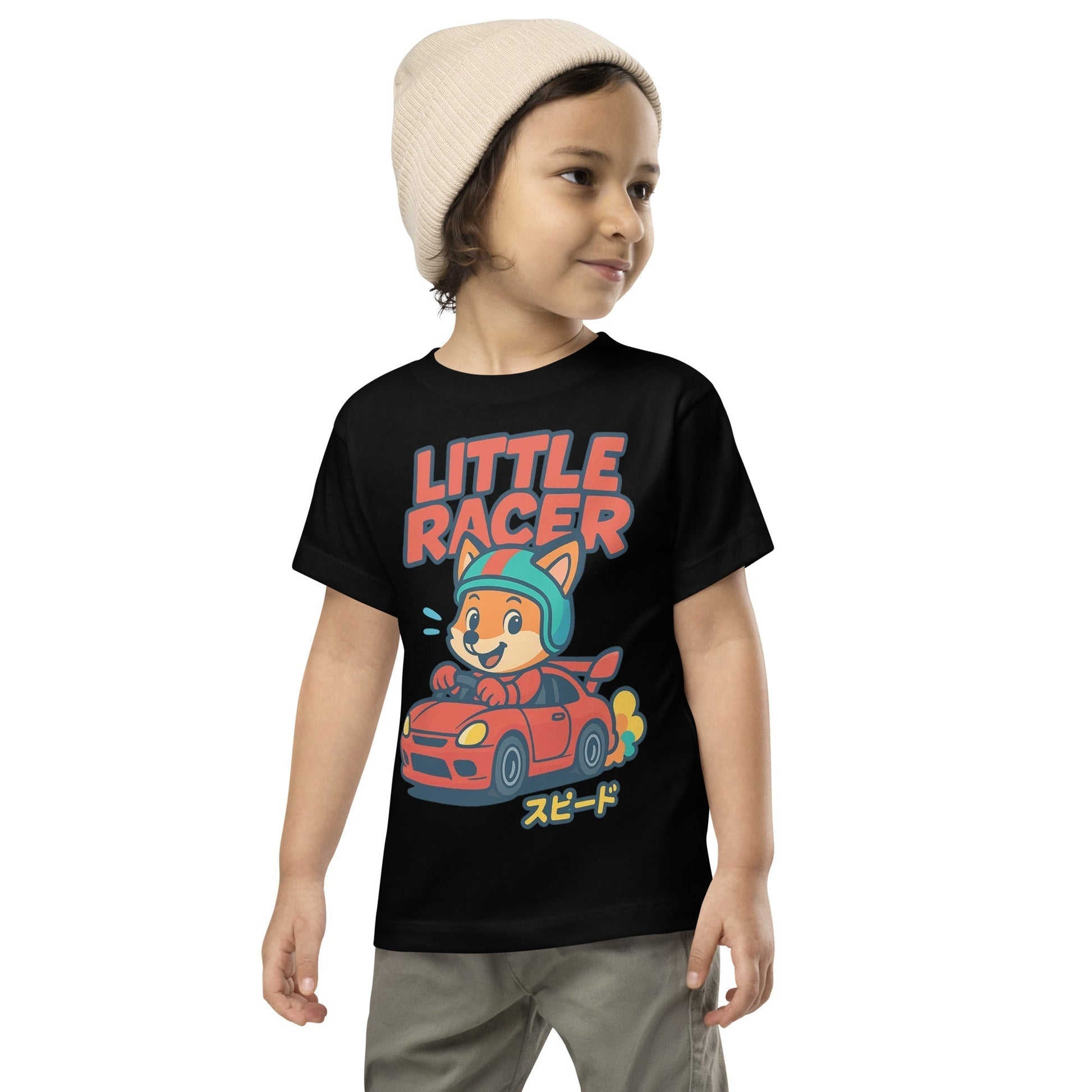 Toddler wearing black Little Racer Fox Tee with cartoon fox driving red sports car and Japanese speed text