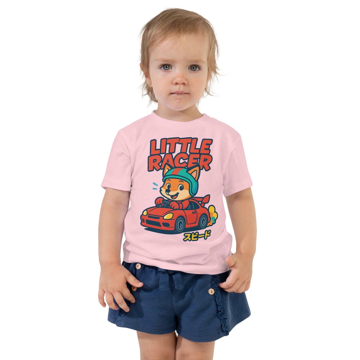 Toddler wearing pink Little Racer Fox Tee with cartoon fox in red sports car and Japanese text