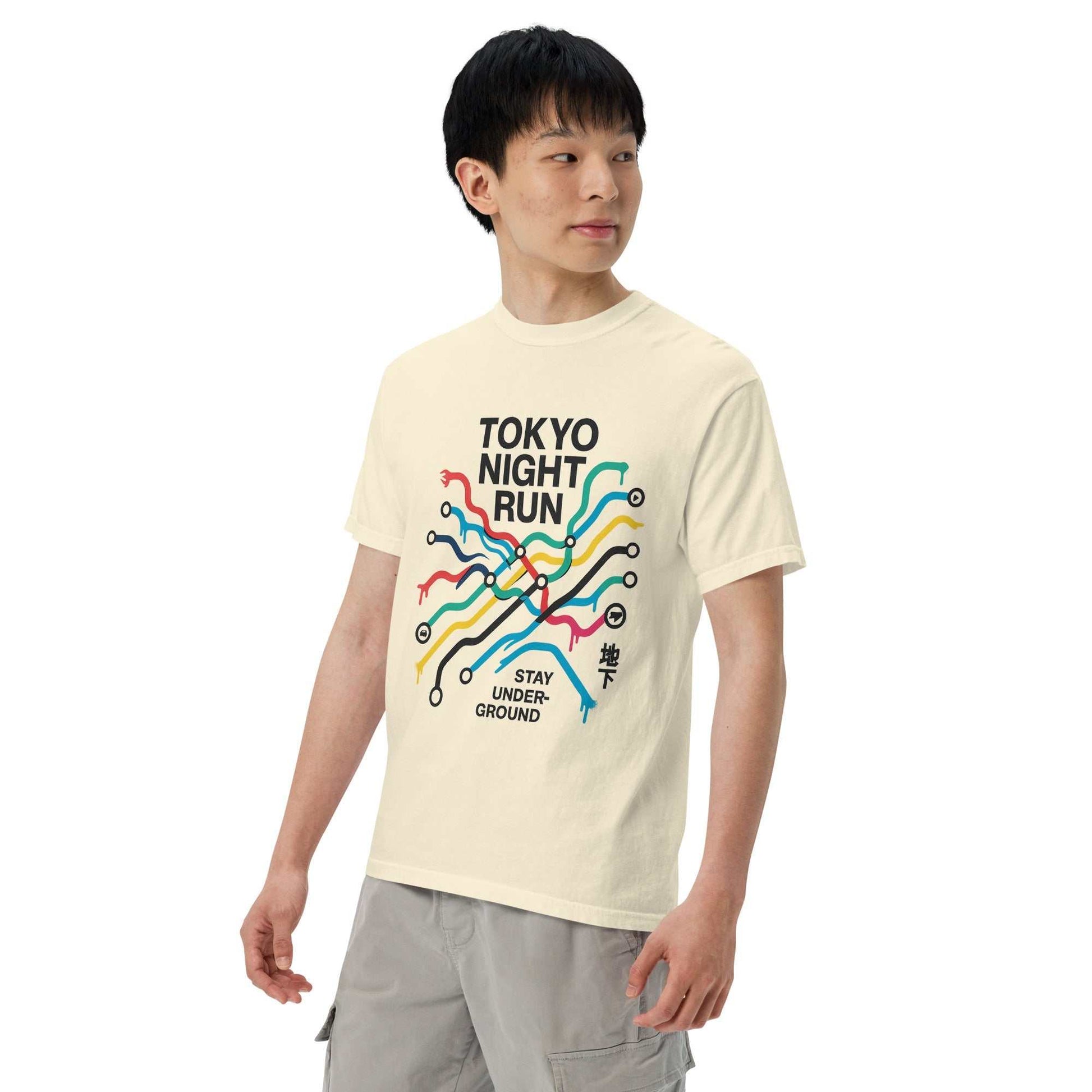 Man wearing cream Tokyo Metro Map Heavyweight Tee with colorful subway map graphic and "Tokyo Night Run Stay Underground" text