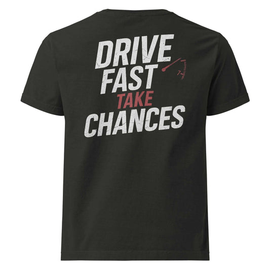 Oversized black tee with "Drive Fast Take Chances" text and redline tachometer graphic, vintage-washed cotton streetwear style