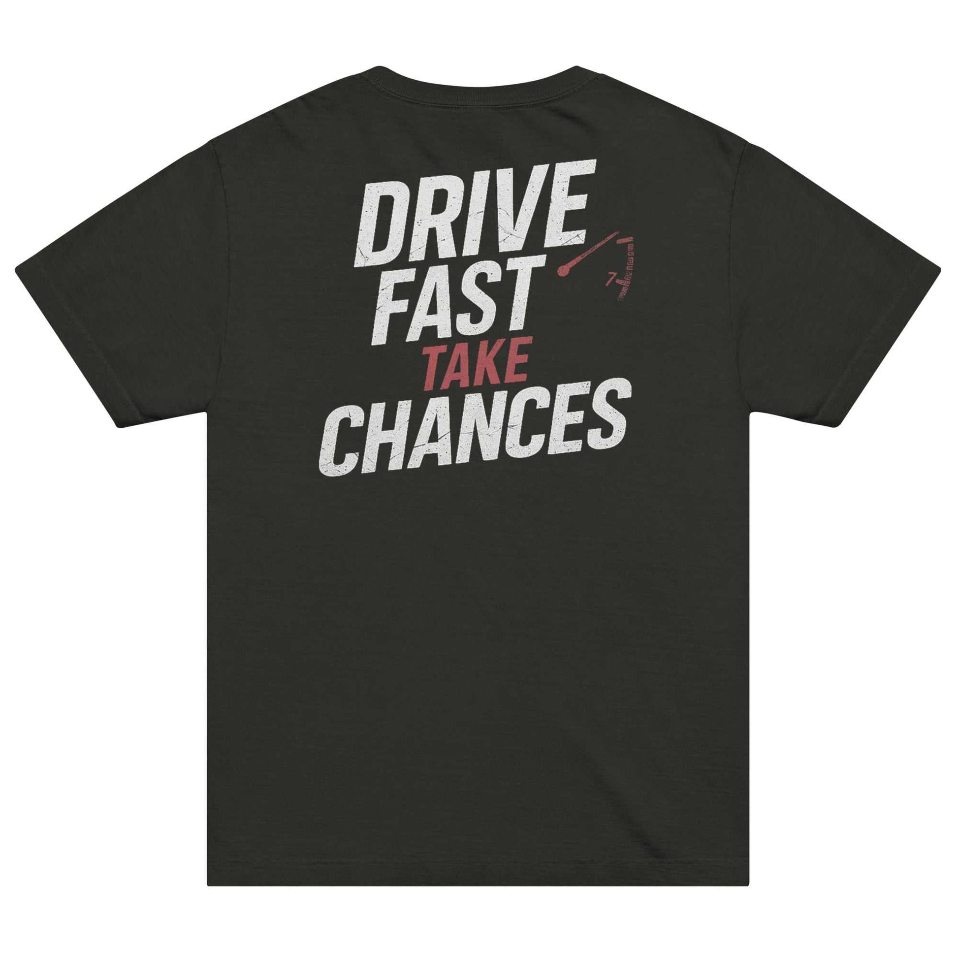 Black oversized tee with bold "Drive Fast Take Chances" white and red text and redline tachometer graphic on the back